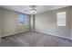 Bedroom featuring natural light from two windows, neutral carpet, neutral walls and base trim at 12816 Alcores St, Las Vegas, NV 89141