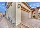 Side view of the garage highlighting the brick driveway and low-maintenance desert landscaping at 12816 Alcores St, Las Vegas, NV 89141