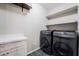 Laundry room featuring a utility sink and modern washer and dryer at 12816 Alcores St, Las Vegas, NV 89141