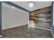 Spacious living room featuring gray tile floors and accent wall at 12816 Alcores St, Las Vegas, NV 89141