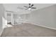 This carpeted loft has a ceiling fan and white railings at 12816 Alcores St, Las Vegas, NV 89141