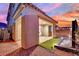 Covered patio leading to a modern water feature, with a glimpse of neighboring homes at 12816 Alcores St, Las Vegas, NV 89141