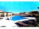 Community pool area with lounge chairs, pergola and mountain views at 12816 Alcores St, Las Vegas, NV 89141