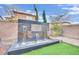 Landscaped backyard with decorative three-tier water feature at 12816 Alcores St, Las Vegas, NV 89141