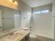 Bathroom featuring vanity with granite countertop, shower over tub, and a tiled backsplash at 1331 Ebbetts Pass, Las Vegas, NV 89110