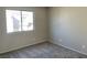 Cozy bedroom showcasing a large window and neutral carpeting at 1331 Ebbetts Pass, Las Vegas, NV 89110