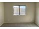 Bedroom featuring neutral paint, carpet and a window overlooking the community at 1331 Ebbetts Pass, Las Vegas, NV 89110