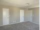 Bedroom features three white doors and soft carpeting at 1331 Ebbetts Pass, Las Vegas, NV 89110