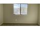 Bedroom featuring a standard window offering natural light and neighborhood views at 1331 Ebbetts Pass, Las Vegas, NV 89110