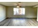 Spacious living room featuring stylish wood flooring and a large window at 1331 Ebbetts Pass, Las Vegas, NV 89110