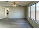 Open-concept living room featuring stylish wood flooring and large windows at 1331 Ebbetts Pass, Las Vegas, NV 89110