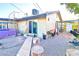 Backyard with wooden pathway, fire pit area, and outdoor storage at 1805 Ivanhoe Way, Las Vegas, NV 89102