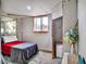 Unfinished basement bedroom with window, closet, concrete flooring and potential for customization at 1805 Ivanhoe Way, Las Vegas, NV 89102