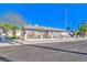 Single-story home with a xeriscaped front yard, white fencing, and large windows at 1805 Ivanhoe Way, Las Vegas, NV 89102