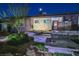 Landscaped front yard featuring stone pathways leading to the home's entrance with a red door at 1805 Ivanhoe Way, Las Vegas, NV 89102