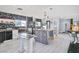 Open kitchen featuring modern appliances, a center island, and sleek countertops at 1805 Ivanhoe Way, Las Vegas, NV 89102