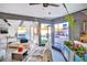 Modern living room with a view of the backyard pool through large glass doors and windows at 1805 Ivanhoe Way, Las Vegas, NV 89102