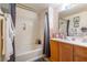 Well-lit bathroom featuring a shower-over-tub combination, vanity with modern fixtures, and neutral tones at 19 E Agate Ave # 307, Las Vegas, NV 89123