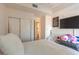 Comfortable bedroom features a tv, closet, and plush decor for cozy living at 19 E Agate Ave # 307, Las Vegas, NV 89123