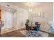 Charming dining area featuring stylish lighting, seating for four, and easy access to the kitchen at 19 E Agate Ave # 307, Las Vegas, NV 89123