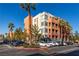 A stylish condo building boasts mature palm trees, meticulous landscaping, and ample parking space at 19 E Agate Ave # 307, Las Vegas, NV 89123