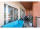 Outdoor patio with comfortable blue seating, grill, and scenic views at 19 E Agate Ave # 307, Las Vegas, NV 89123