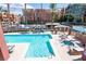 Resort style pool and spa with lounge chairs in an upscale community at 19 E Agate Ave # 307, Las Vegas, NV 89123