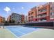 Outdoor tennis court with surrounding buildings. Enjoy recreational amenities at 19 E Agate Ave # 307, Las Vegas, NV 89123