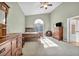 Large primary bedroom with neutral carpet, wooden furniture, and bright window at 2107 Eaglepath Cir, Henderson, NV 89074