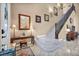 Inviting foyer with staircase, console table with lamps, and tiled floor at 2107 Eaglepath Cir, Henderson, NV 89074