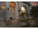 Charming front entry with decorative door, manicured landscaping, and inviting walkway leading to the home at 2107 Eaglepath Cir, Henderson, NV 89074