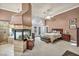 Spacious main bedroom featuring a fireplace, ceiling fan, and outdoor access at 2107 Eaglepath Cir, Henderson, NV 89074