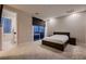 Bedroom featuring neutral colors and a sliding glass door with covered patio at 221 Errogie St, Henderson, NV 89012