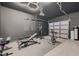 Converted garage gym with sleek dark grey walls, providing ample space for workout equipment and fitness activities at 221 Errogie St, Henderson, NV 89012