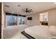 This comfortable carpeted main bedroom leads out to a cozy balcony at 221 Errogie St, Henderson, NV 89012