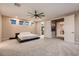 This primary bedroom features soft carpet and a sleek bed frame at 221 Errogie St, Henderson, NV 89012