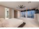 This carpeted main bedroom includes a sleek flat screen television at 221 Errogie St, Henderson, NV 89012