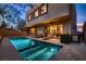 Backyard pool area with lounge chairs and a built-in barbecue, perfect for outdoor relaxation and entertaining at 221 Errogie St, Henderson, NV 89012