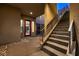 Modern staircase with metal railings leading to the upper level, highlighting the home's contemporary interior architecture at 221 Errogie St, Henderson, NV 89012