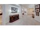 Welcoming foyer features tile flooring, neutral paint, and decorative console table with artwork at 2239 Discovery Lake Ct, Henderson, NV 89044