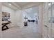 Bright foyer leading to a living area, featuring tile flooring, neutral walls, and recessed lighting at 2239 Discovery Lake Ct, Henderson, NV 89044