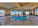 Bright hot tub room with blue tile accents and a large picture window offering outdoor views of the desert at 2239 Discovery Lake Ct, Henderson, NV 89044