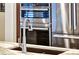 A stainless steel faucet is centered near a stainless steel oven and refrigerator at 2239 Discovery Lake Ct, Henderson, NV 89044