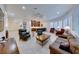 Open-concept living room with tile flooring, plantation shutters, and a large seating area at 2239 Discovery Lake Ct, Henderson, NV 89044