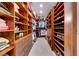 Well-organized walk-in closet with custom shelving, drawers, and ample storage space at 2239 Discovery Lake Ct, Henderson, NV 89044