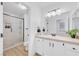 Bathroom features a glass-enclosed shower and a vanity with white countertops at 2728 Monrovia Dr, Las Vegas, NV 89117