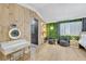 Bright bedroom with unique wood wall accent and a vanity at 2728 Monrovia Dr, Las Vegas, NV 89117