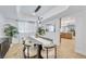 Dining area with a modern table, seating for ten, and lots of natural light at 2728 Monrovia Dr, Las Vegas, NV 89117