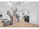 Bright hallway with decorative staircase, furniture cabinet, decor and an ornate mirror at 2728 Monrovia Dr, Las Vegas, NV 89117