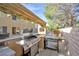 Outdoor grilling area with a built-in grill and counter space near the pool at 2728 Monrovia Dr, Las Vegas, NV 89117